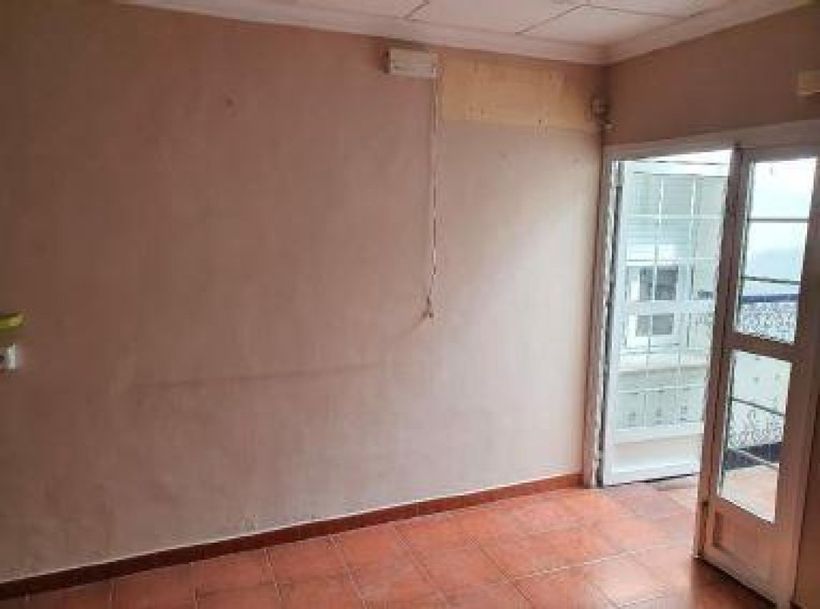 Acceso al patio de la vivienda de CaixaBank