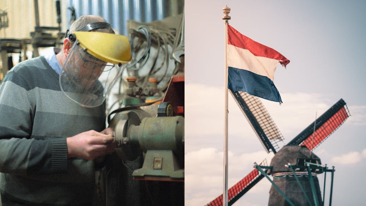 Un trabajador junto a una bandera de Holanda